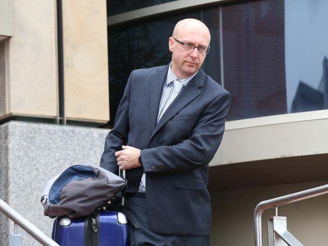 John Pickering SC leaves court.  Tim Ellis Director of Public Prosecutions in the Hobart magistrates court pleading not guilty to the charge of negligent driving causing death.  Picture Nikki Davis-Jones.