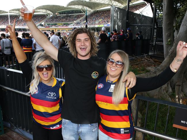 Crows fans Rhianna Jennings, Jai Pullinen, and Ainz Koenig. Picture: Dylan Coker
