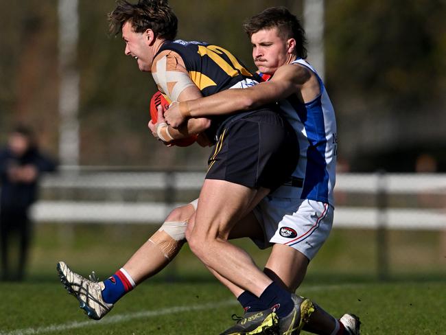 NFL: Whittlesea’s Max Dyson is taken down by West Preston-Lakeside’s Hayden Delos. Picture: Andy Brownbill