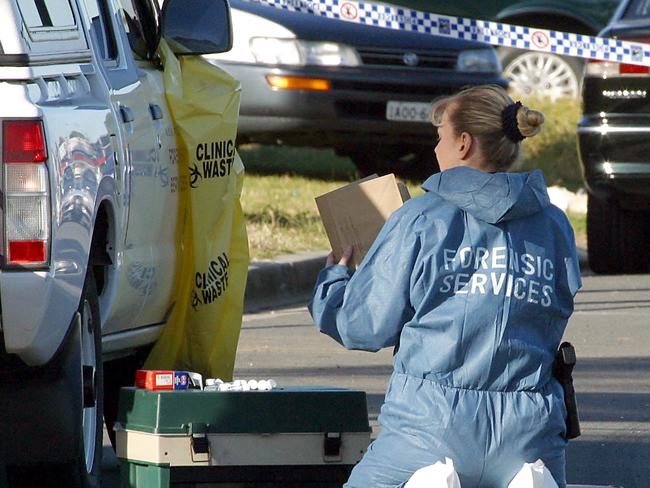 A forensic officer works at the scene of the shooting of Ali Abdul Razzak in Lakemba. Picture: Glenn Miller