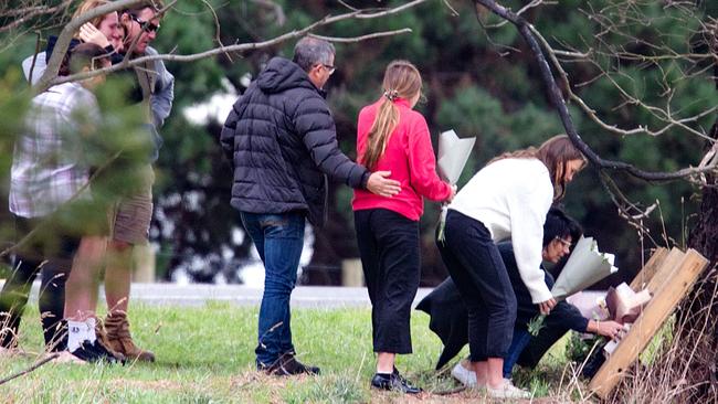 People gathered at the site of yesterday’s crash in Anderson, which claimed the life of Campbell Ion, 16 and left his brother Lucas, 18 in hospital. Picture: Sarah Matray