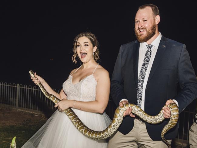 Newlyweds Bek and Wade Bleisner pose with an unlikely wedding crasher. Picture: Lisa McTiernan