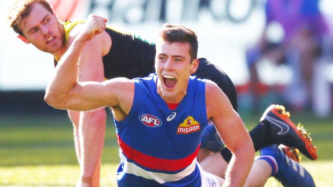 Josh Dunkley celebrates one of two goals in a matter of minutes as David Astbury looks on. Picture: Getty Images