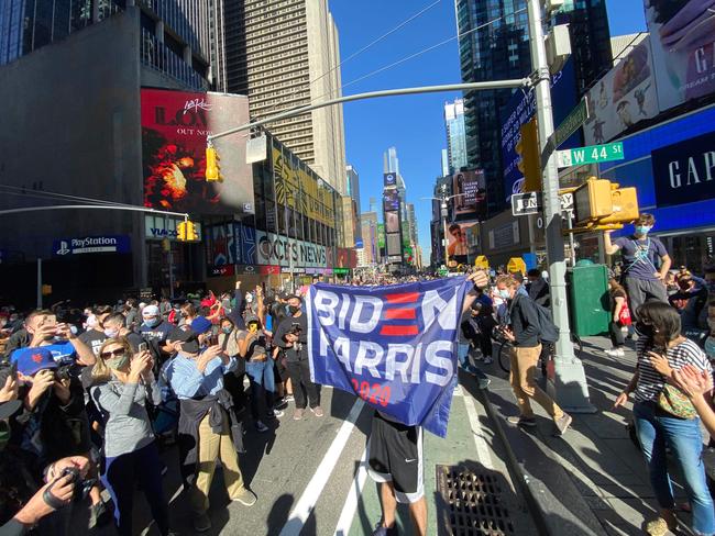 Biden supporters celebrate in New York’s Times Square after Joe Biden was declared the winner of the 2020 presidential election. Picture: AFP