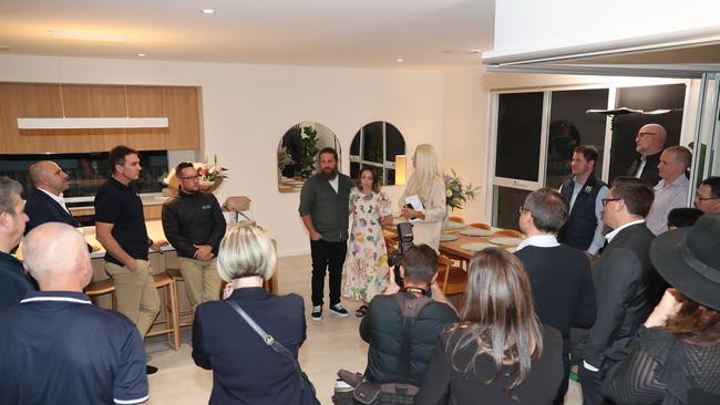 Danielle and Rhys Carroll speak to supporters at their new home on the Gold Coast. Picture: Glenn Hampson.