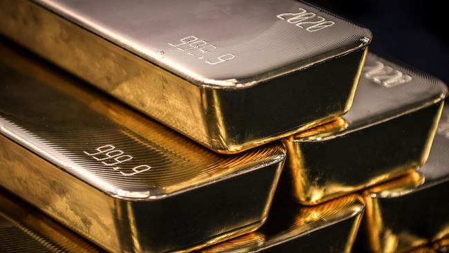 TOPSHOT - Gold bullion bars are pictured after being inspected and polished at the ABC Refinery in Sydney on August 5, 2020. - Gold prices hit 2,000 USD an ounce on markets for the first time on August 4, the latest surge in a commodity seen as a refuge amid economic uncertainty. (Photo by DAVID GRAY / AFP)