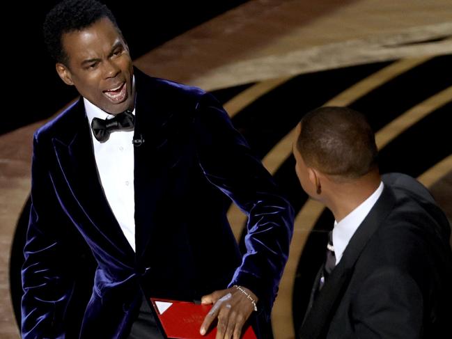 HOLLYWOOD, CALIFORNIA - MARCH 27: (L-R) Chris Rock and Will Smith are seen onstage during the 94th Annual Academy Awards at Dolby Theatre on March 27, 2022 in Hollywood, California. (Photo by Neilson Barnard/Getty Images)