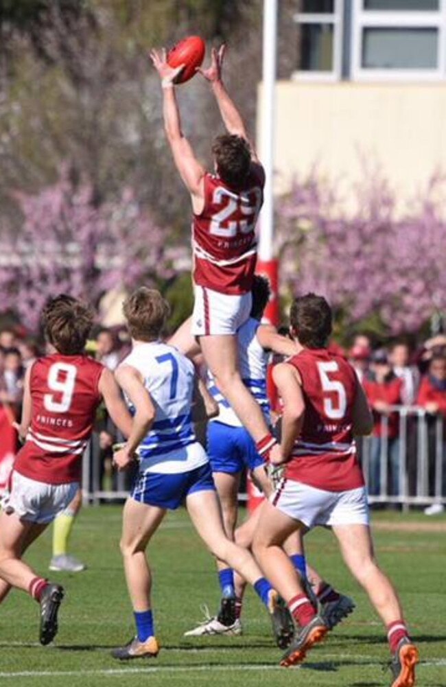 Tom Sparrow takes a strong mark for Prince Alfred College.