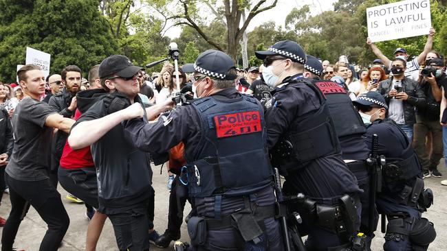 Protesters clash with police in Melbourne. Picture: Daniel Pockett