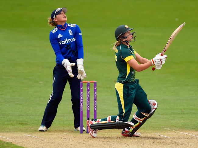 English keeper Sarah Taylor looks on as Australia’s Meg Lanning hits out during the 3rd ODI of the Women's Ashes series earlier this year in Worcester, England. Picture: Stu Forster/Getty Images