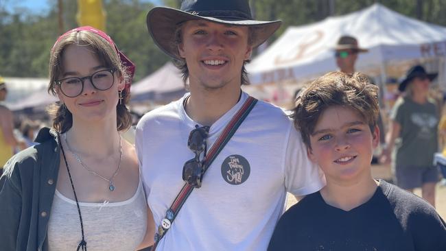 Lola Beaumont, Sam Roberts, and Huey Bayldon, from England and Brisbane, enjoy day one of the 2024 Gympie Muster, at the Amamoor State Forest on August 22, 2024.