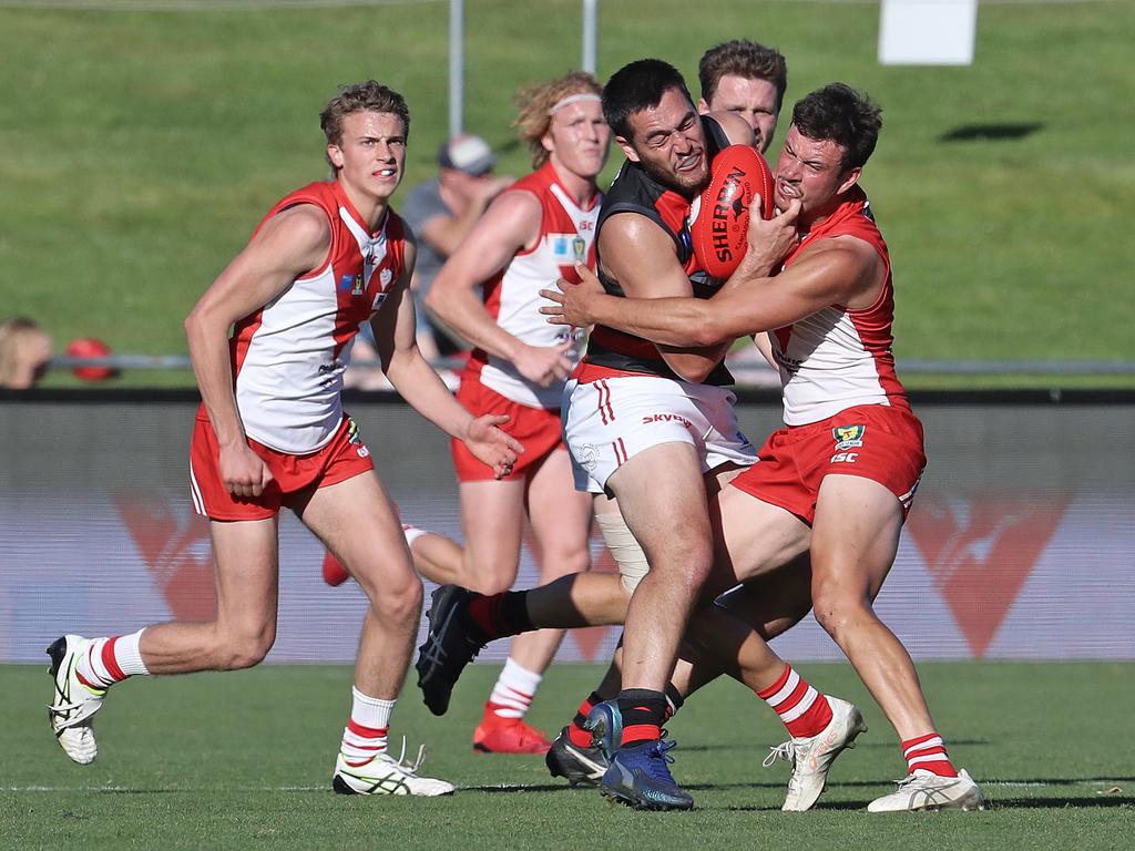 Lauderdale’s Phillip Bellchambers is wrapped up in a tackle by Clarence’s Gabriel Chambers in their TSL clash at BLundstone Arena. Picture: LUKE BOWDEN