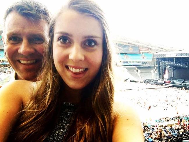 Mike Baird with one of his daughter at the Taylor Swift show in Sydney. Photo: Facebook