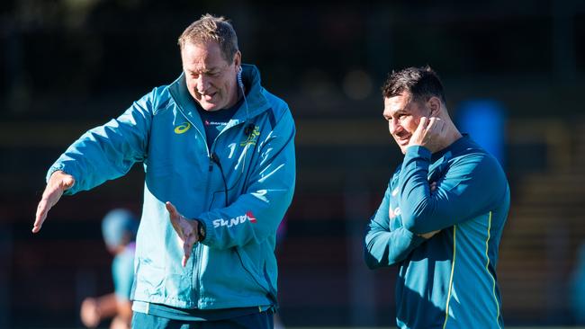 Skills coach Mick Byrne (L) and George Smith.