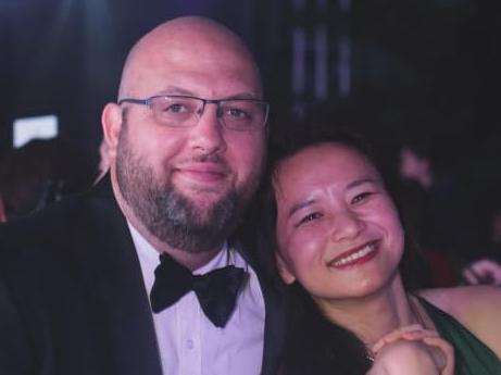 Nick Coyle and his partner, Australian journalist Cheng Lei, who was detained in China in August 2020. They are together at the Ball on the Wall event in Beijing in 2019. Picture: Supplied