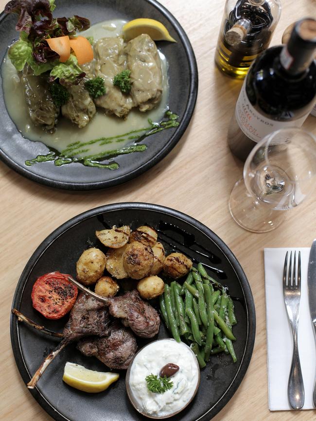 Chargrilled Tasmanian lamb cutlets, chunky lemon roast potatoes and seasonal vegetables, bottom, and cabbage rolls filled with mince, rice and Greek herbs.