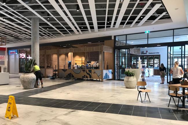 Workers putting the finishing touches on the Westfield Coomera at Coomera Town Centre