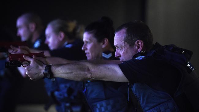 Police recruits make use of the firearms simulation facility at the academy. Picture: Jake Nowakowski