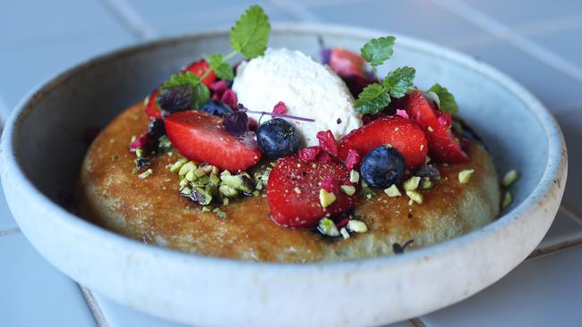 The pistachio and blueberry ricotta hotcake tastes as good as it looks. Picture: NIKKI DAVIS-JONES