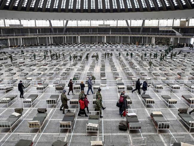 Chinese doctors inspecting a makeshift hospital inside a hall at the Belgrade Fair on March 24. Picture: Oliver Bunic/AFP