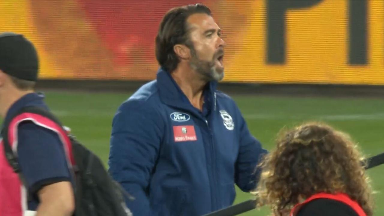Geelong coach Chris Scott yells out at umpire Ray Chamberlain at halftime.