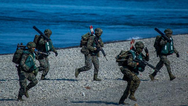 Soldiers disembark from AAV7 amphibious assault vehicles during the Han Kuang military exercise, which simulates China invading the island. Picture: Annabelle Chih/Getty