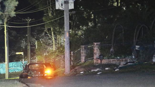 A damaged car in Caladenia Cl, Elanora Heights. Picture: News Corp