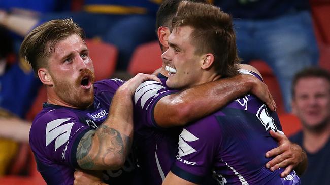 BRISBANE, AUSTRALIA - OCTOBER 03: Cameron Munster and Ryan Papenhuyzen of the Storm celebrate a try during the NRL Qualifying Final match between the Melbourne Storm and the Parramatta Eels at Suncorp Stadium on October 03, 2020 in Brisbane, Australia. (Photo by Jono Searle/Getty Images)