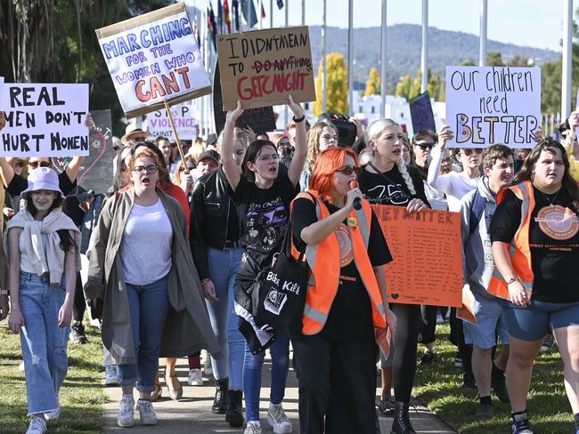 CANBERRA, Australia, NewsWire Photos. April 28, 2024: Demonstrators arrive at the No More! National Rally Against Violence march at Parliament House in Canberra, as 29 Women have been killed as a result of violence by men already this year. NCA NewsWire / Martin Ollman