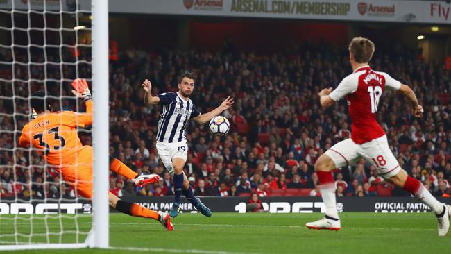 Rodriguez shoots past Petr Cech.