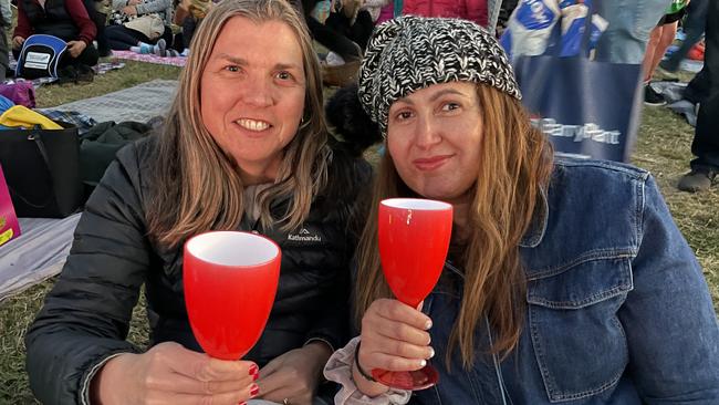 Templestowe Lower friends Julie and Ana enjoy Manningham's 2022 Carols at Ruffey Lake Park.