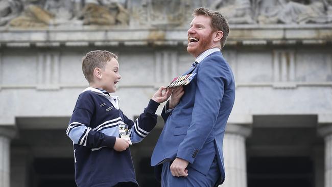 St Patrick’s Primary student  Finn Shortt looks in amazement at Dan Keighran’s Victoria Cross.  Picture: David Caird.