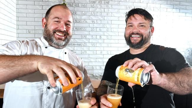 Lachlan Scott of Flour &amp; Chocolate Patisserie and Dave Ward of Aether Brewing enjoy the new beer Nitro Bee Sting. Aether Brewing have teamed up with an unusual partner for their latest beer – beloved Brisbane bakery Flour &amp; Chocolate Patisserie. Tuesday July 14, 2020. (Picture, John Gass)