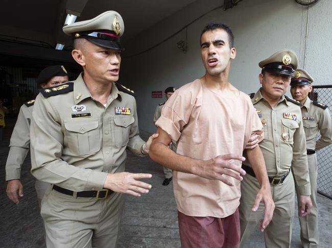 Bahraini Hakeem al-Araibi, center, leaves the criminal court in Bangkok, Thailand, Bangkok, Thailand, Monday, Feb. 4, 2019. The soccer player who has refugee status in Australia told a Thai court Monday that he refuses to be voluntarily extradited to Bahrain, which has asked for his return to serve a prison sentence for a crime he denies committing. (AP Photo Wason Wanichakorn)