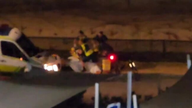 Queensland Ambulance Service tending to an injured person allegedly hit by an e-scooter along the Oceanway Surfers Paradise, October 23, 2023.