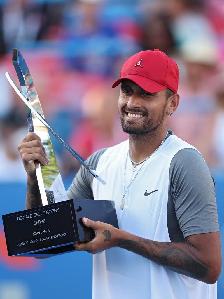 Kyrgios with the spoils of victory. Photo by Patrick Smith/Getty Images