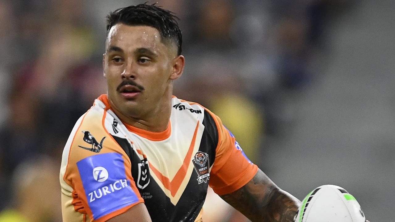 TOWNSVILLE, AUSTRALIA - MAY 24: Jayden Sullivan of the Tigers runs the ball during the round 12 NRL match between North Queensland Cowboys and Wests Tigers at Qld Country Bank Stadium, on May 24, 2024, in Townsville, Australia. (Photo by Ian Hitchcock/Getty Images)