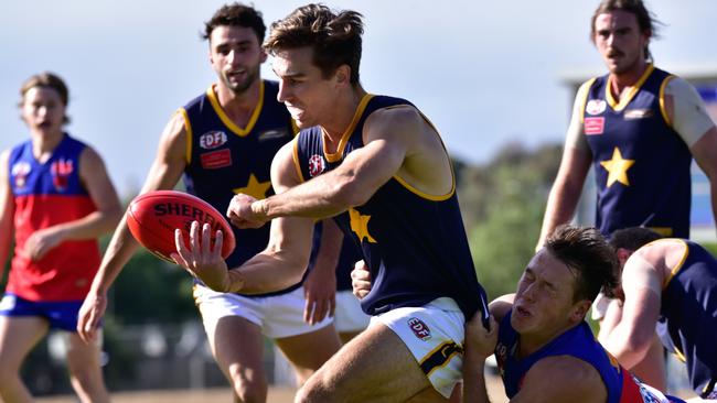 Patrick Willach fires off a handball for Essendon Doutta Stars. Picture: Jamie Morey