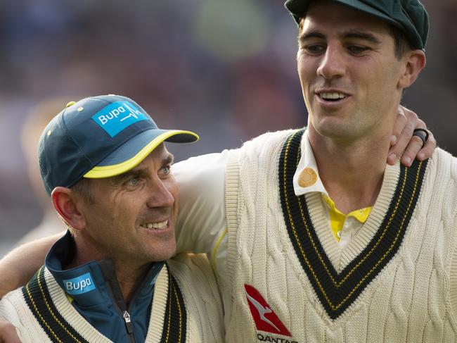 MANCHESTER, ENGLAND - SEPTEMBER 08: Australia Coach Justin Langer celebrates with bowler Pat Cummins during day five of the 4th Ashes Test Match between England and Australia at Old Trafford on September 08, 2019 in Manchester, England. (Photo by Visionhaus)