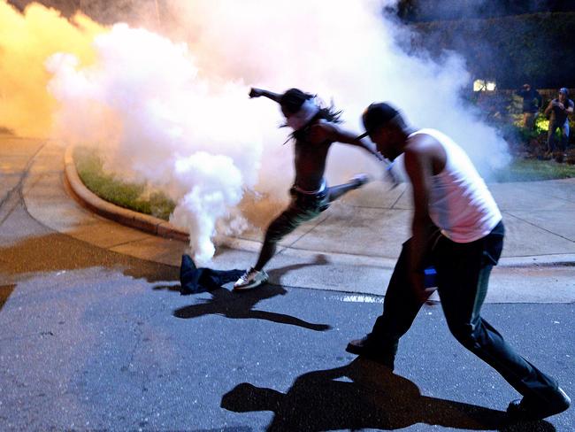 Authorities used tear gas to disperse protesters in an overnight demonstration that broke out Tuesday after Keith Lamont Scott was fatally shot by an officer at an apartment complex. Picture: Jeff Siner/The Charlotte Observer via AP