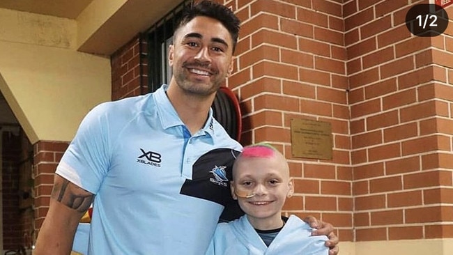 Sharks star Shaun Johnson and young leukaemia sufferer Jason Braniff.