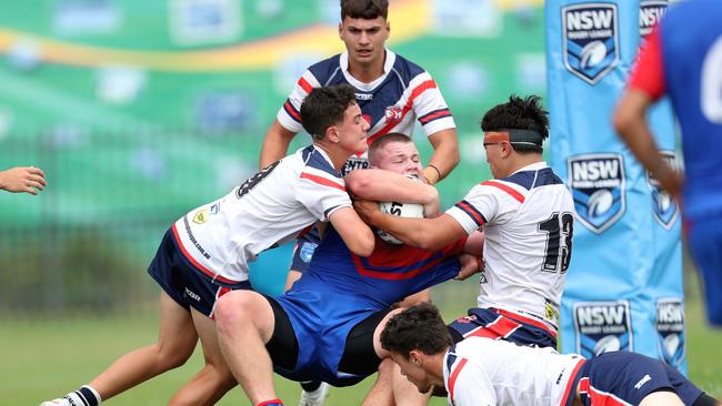 Tough action from the Newcastle Maitland Region Knights vs Central Coast Roosters. Picture: Sue Graham