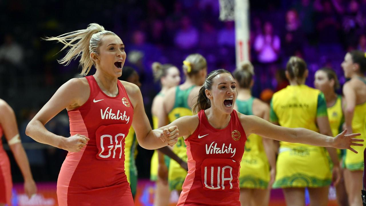 Helen Housby and Natalie Metcalf (Co-Captain) of England celebrate.