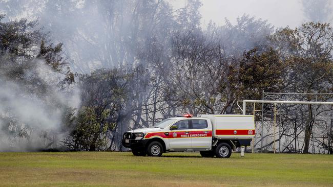 A QFES ute on the oval of St Michael's College at Merrimac. Picture: Jerad Williams