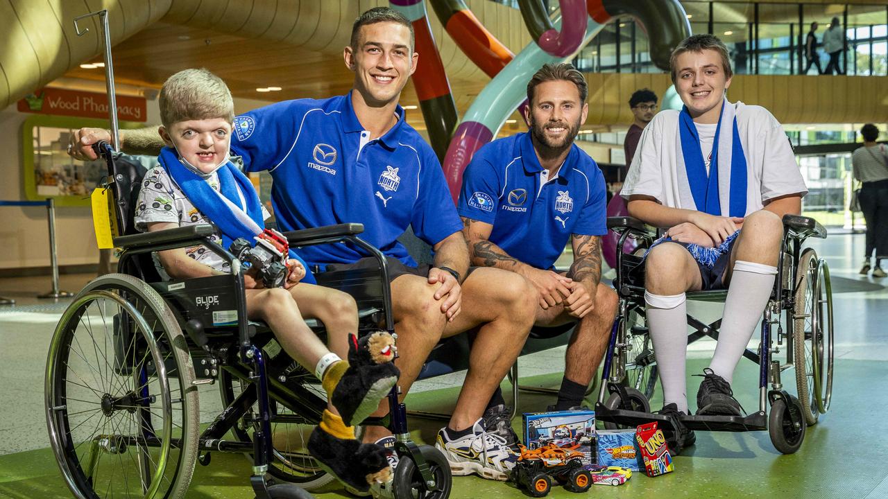 North Melbourne players visited patients at the Royal Children Hospital ahead of the SuperClash fundrasier. Picture: Jake Nowakowski