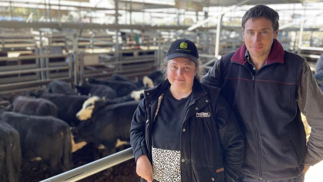 Tom Sutherland and Rachel Owen at the Bairnsdale store cattle sale where they purchased 18 black baldy heifers at $1510 from the feature line of Kent Park cattle. Picture: Petra Oates