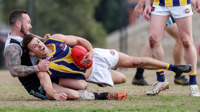 EDFL: Rupertswood’s is wrapped up by Jackson Volpato of Hillside. Picture: George Salpigtidis