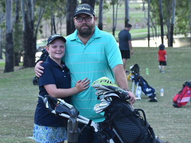 Lily McGuiness with her dad Scott during the US Kids Golf Foundation Australian Open in Rockhampton in 2022.