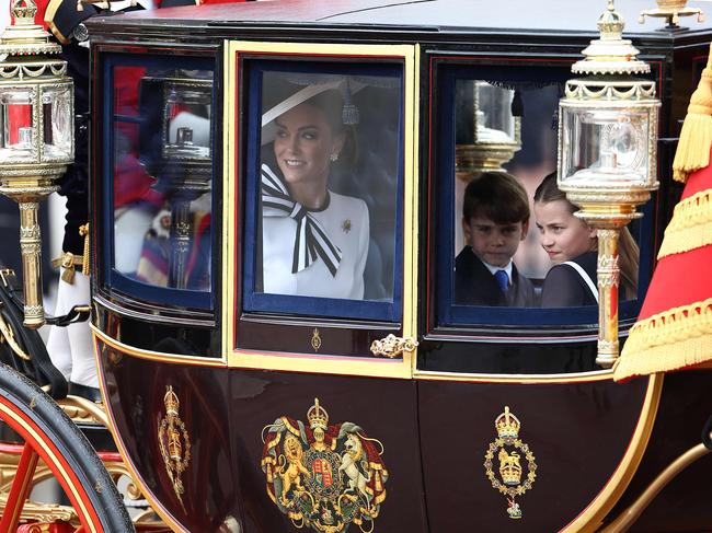 Lucky Kate has Charlotte to help keep cheeky Louis in line. Photo: AFP.