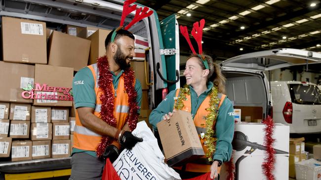 Toll courier drivers Pritpal Singh and Stacey Huddleston at the Toll Adelaide Airport dispatch centre. Toll SA have noticed a massive rise in air freight orders this year. Picture: Naomi Jellicoe